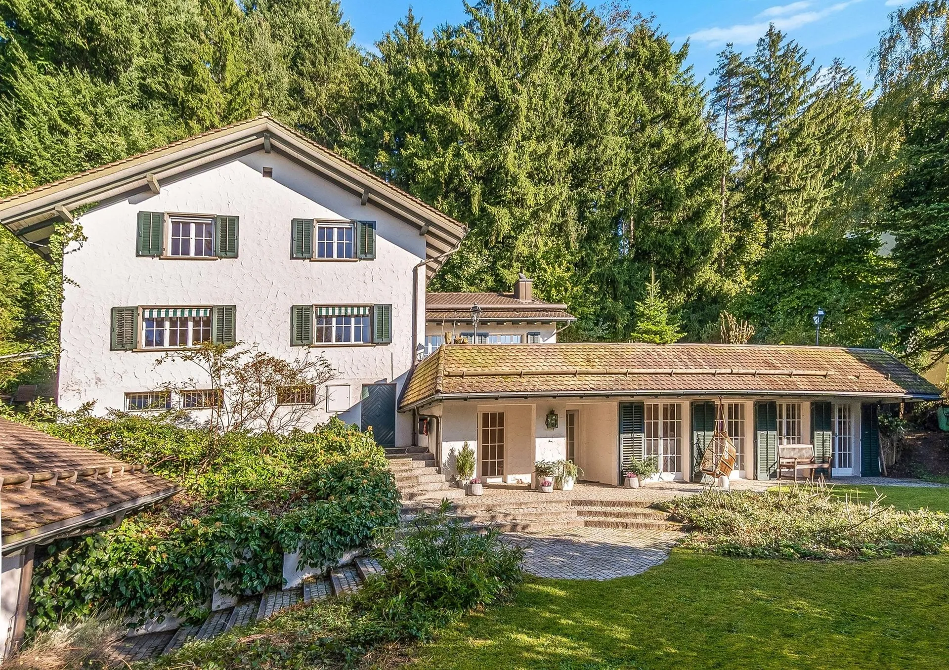 Dreamy country house on the edge of the forest with a picturesque garden